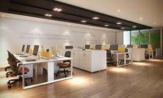 an office with white desks and yellow chairs in it's center room area