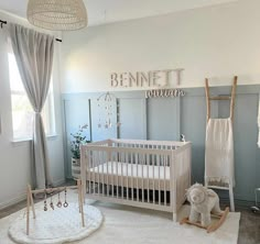 a baby's room with a crib, rocking horse and other items on the floor