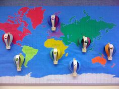 the world map is covered in different colored paper and magnets to help students learn how to use them