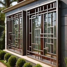 an exterior view of a house with windows and bushes