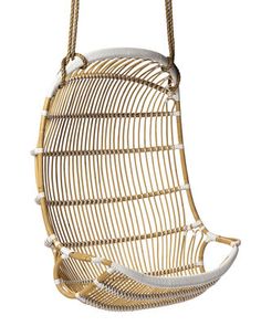 a hanging chair made out of rattan and rope, with the seat up to one side