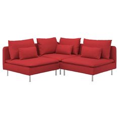 a red sectional couch with pillows on it's back and legs, in front of a white background