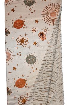 an image of a blanket with planets and stars on it's side, as if in the outer space