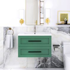 a bathroom with marble walls and green drawers