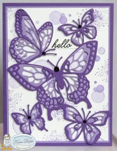 a card with purple butterflies on it and the words hello written in black ink,