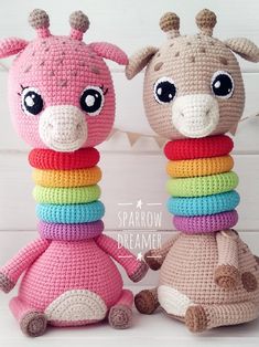 two crocheted giraffes sitting next to each other