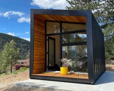 a small house made out of shipping containers