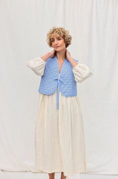 "We believe in handmade! Every piece is dedicated and made to the person who ordered it by using old traditional skills. About the vest: Vest is made in a beautiful padded floral fabric. Influenced by traditional costume but reimagined with a feminine modern touch. Style it by teaming it with any of your favorite linen dresses. * Handmade in our studio * Loose fit * V-neckline * Ties * Reversible * Contrasting cotton borders * Available in double sizes from XXS/XS to XXL or can be made in a cust Traditional Cotton Vest For Spring, Traditional Sleeveless Vest For Spring, Traditional Sleeveless Spring Vest, Dress With Vest Outfit, Quilted Vest Outfit, Vest Style Women, Quilted Coats, Dresses Handmade, Linen Vest