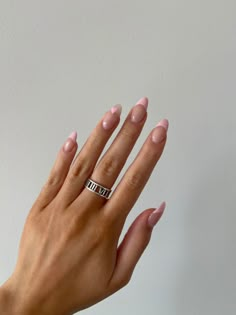 Tan hand against a white wall with pink French tip acrylic almond shape nails and an accent nail with a heart in the right corner Light Pink French Tip Nails, Light Pink French Tip, 22 Nails, Acrylic French, Prom 2022, Accent Light, French Acrylic Nails, Almond Shape