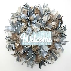 a wreath with the word welcome on it