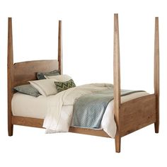 a wooden bed frame with four posts and pillows on it's sides, against a white background