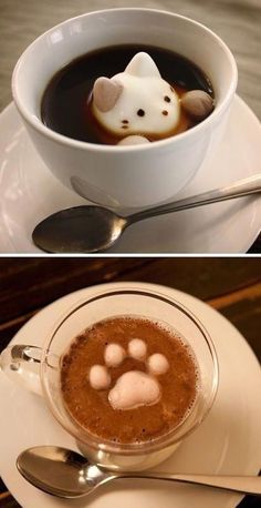 there is a cup of hot chocolate with cat's paw in it