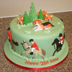 a birthday cake with horses and dogs on it