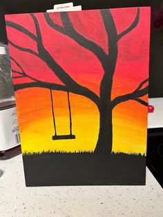 an acrylic painting of a tree with a swing at sunset