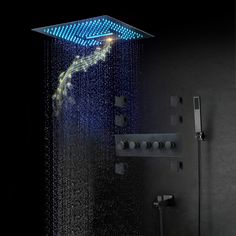 a shower head with rain coming out of it and music notes on the wall next to it