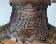 a man with tattoos on his neck and chest