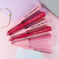 pink personalized lip glosses with name tags on them