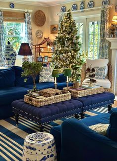 a living room filled with furniture and a christmas tree