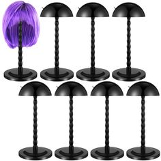 six black lamps with purple hair on each one and four different shades of the same color