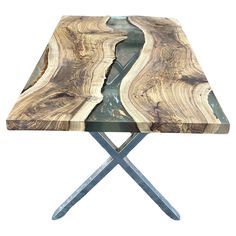 a wooden table with two metal legs and a wood slab on it's edge