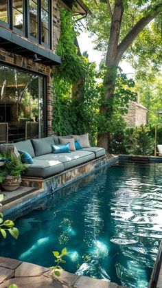 a couch sitting next to a swimming pool