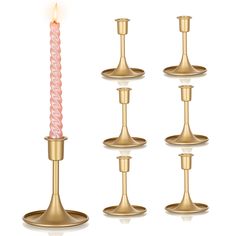 a set of four candles in different sizes