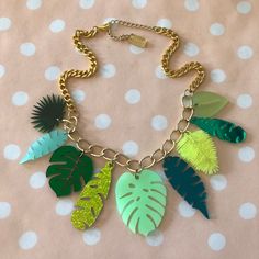 "This is my new favorite summer & vacation necklace! I designed and laser cut all of the charms from 1/8\" thick acrylic in an assortment of bright opaque, frosted, glittered and mirrored acrylics. The charms hang from a thick gold chain. The chain measures 19\" total- 16\" with an added 3\" extender clasp." Thick Gold Chain, Leaves Necklace, Ocean Jewelry, Laser Cut Acrylic, Plastic Jewelry, Acrylic Plastic, Acrylic Charms, Leaf Necklace, Tropical Leaves