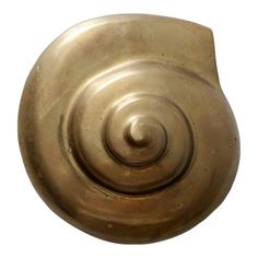 an old brass door knob with a spiral design on it's side, isolated against a white background