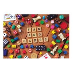 the word game time spelled out in scrabble letters surrounded by toys on a wooden table