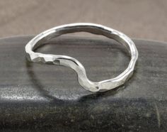 Simply Bold introduces to you a simple hammered wave ring. This ring is perfect for any beach lover and they stack nicely together for a textured and layered look. A slight hammered wave is formed using 14 gauge wire. It is hand soldered and then tumbled for many hours for strength and to add a beautiful high shine. Made to order in your size. Materials: *Sterling SilverMeasurements:*Band Width: 14 gauge or 1.6mm (May be slightly wider due to hammering)Please allow 5-7 days on all made to order Beach Rings, Cheap Rings, Hammered Rings, Wave Ring, Hammered Sterling Silver, Beach Lover, Ring Stacking, Wire Rings, Ring Photos