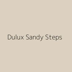 the words dulux sandy steps are in black and white on a light gray background