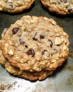 cookies with chocolate chips and oats on a baking sheet