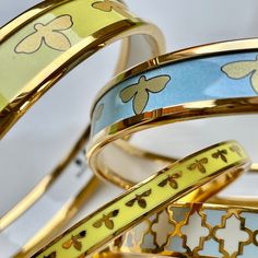 The Bee Bangle in delicate forget-me-not blue is sure to cause a buzz wherever it's worn.   It slides easily over the wrist and has been handcrafted from enamel by the Halcyon Days artisans. It's finished with 18ct gold-plated raised edges. Luxury Enamel Bangle For Gift, Luxury Enamel Bangle As Gift, Blue Enamel Bangle Gift, Blue Enamel Bangle As A Gift, Blue Enamel Bangle Perfect As A Gift, Bee Silhouette, Forget Me Not Blue, Bee Bracelet, Jewellery Photography Inspiration