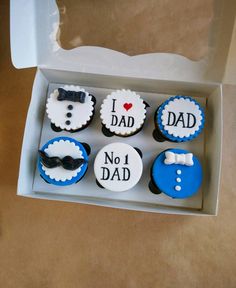 a box filled with cupcakes that say i love dad