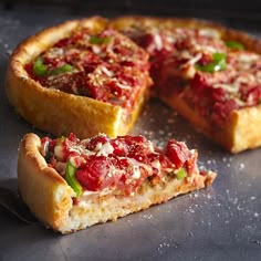 a deep dish pizza is cut into pieces