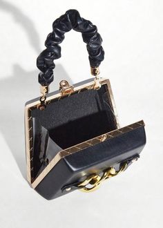 This Chain Decor Eco Leather Mini Square Bag is a stylish and environmentally-friendly accessory that is perfect for any occasion. Made of high-quality eco leather, this bag features a chic chain decoration and comes in a sleek black color. Add a touch of sophistication to your outfit while also supporting sustainability. Material: Polyurethane Elegant Box Bag With Chain, Chic Square Box Bag With Chain Strap, Elegant Bags With Gold Chain As Fashion Accessory, Elegant Bags With Gold Chain, Elegant Top Handle Bag With Chain, Elegant Bags With Gold Chain For Fashion, Square Box Bag With Chain For Evening, Chic Rectangular Box Bag With Chain, Square Chain Box Bag For Evening