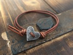 Hand forged adjustable bracelet made with: -Fine Pewter -Genuine Leather Copyright © 2022 DESIGNbyANCE All rights reserved Bracelet En Cuir Diy, Tiny Heart Bracelet, Wrapped Bracelets, Wrap Armband, Diy Leather Bracelet, Diy Ring, Bracelets Women, Silver Heart Bracelet, Stamped Metal