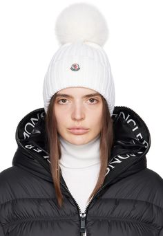 5 gauge rib knit modacrylic-blend beanie in white. · Faux-fur pom-pom appliqué at crown · Felted tricolor logo patch at rolled brim Supplier color: White Pom Pom Hat Outfit, Knitted Swimsuit, Snow Wear, Bodysuit Blouse, Cross Bag, Faux Fur Pom Pom, Pom Beanie, Walker Boots, Fur Pom Pom