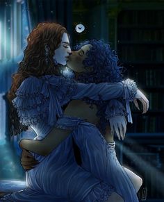 two women hugging each other in front of a bookshelf