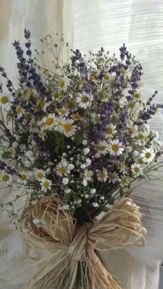 a bouquet of wildflowers tied to a burlock