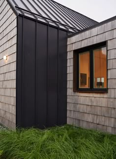 the side of a house that is made out of wood and metal