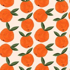 an orange pattern with green leaves on it