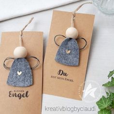 two tags with wooden beads attached to them