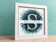 a white frame with the word sulllivan printed on it