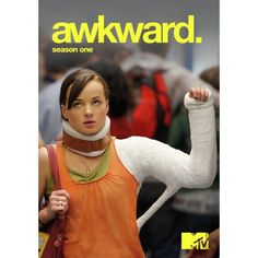 a woman in an orange shirt is holding her arm up with the words awkward on it