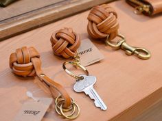 several different types of leather keychains on display