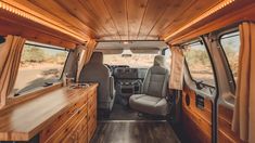 the interior of an rv with wood paneling