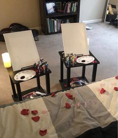 two chairs with hearts on them sitting next to each other