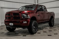 a large red truck parked in a garage