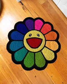 a colorful rug with a smiley face on it